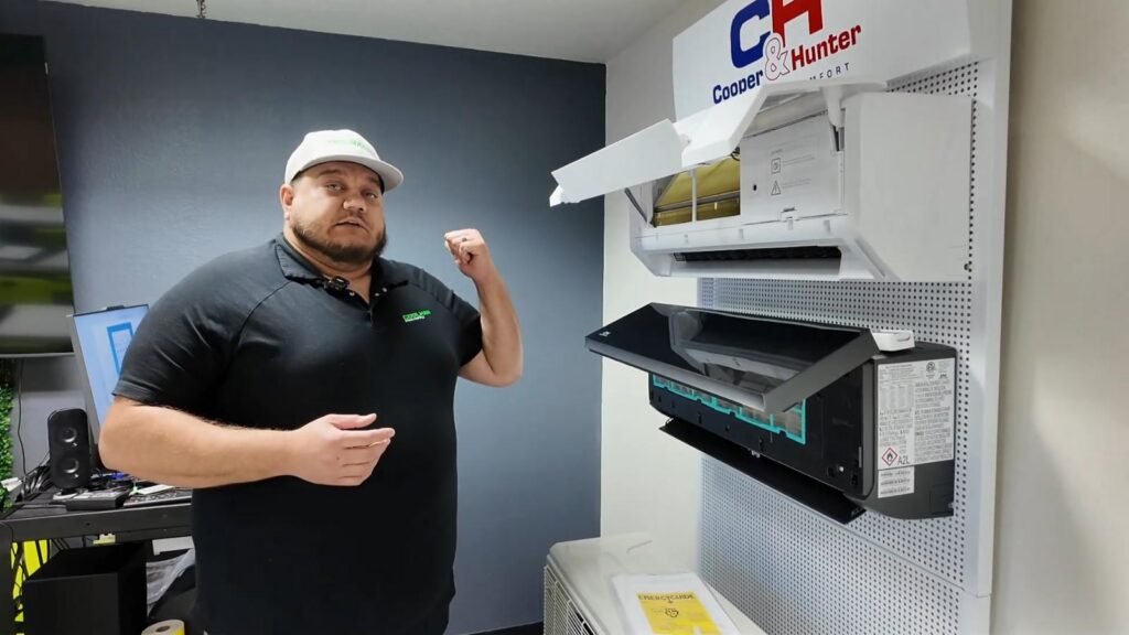 Alex shows Cooper & Hunter wall mount units in the Coolman HVAC Supply training room