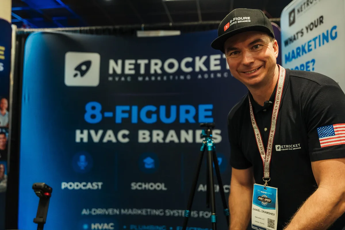 Daniel Dramshev, host of the 8-Figure HVAC Brands Podcast, at the Netrocket booth