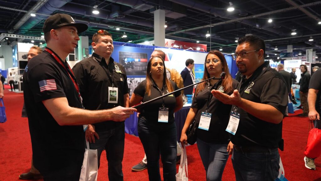 Manuel Gómez of Hunters HVAC talks to Daniel Dramshev at AHR Expo