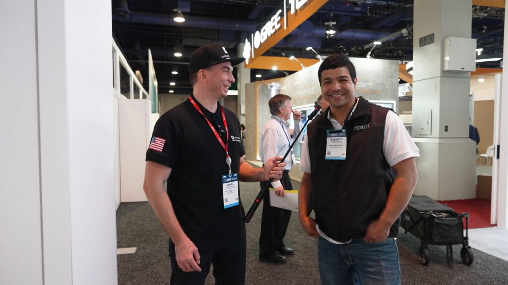 Daniel Dramshev talks with Roberto Flores of Bionic Mechanical at AHR Expo in Las Vegas